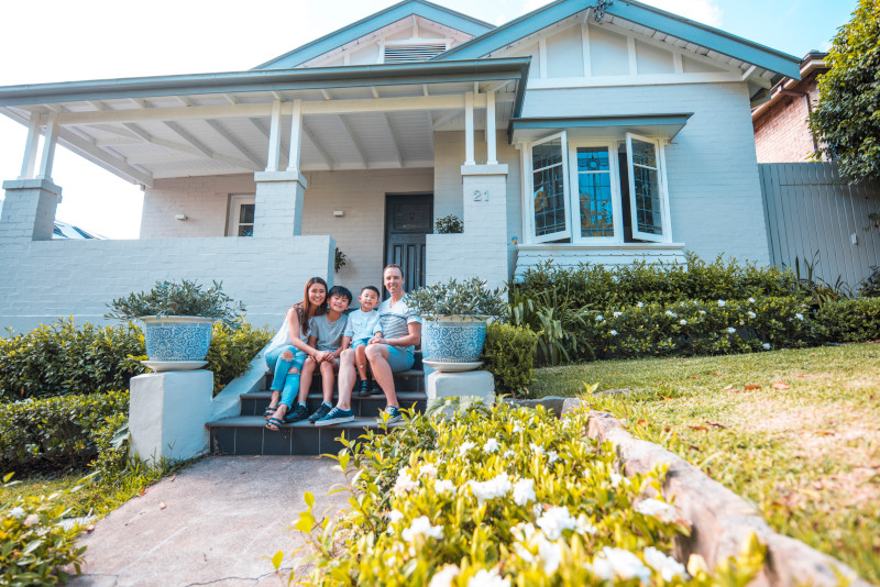 happy family in front of the house